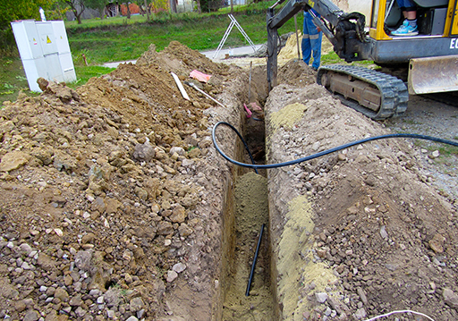 Kopání základů bagrem